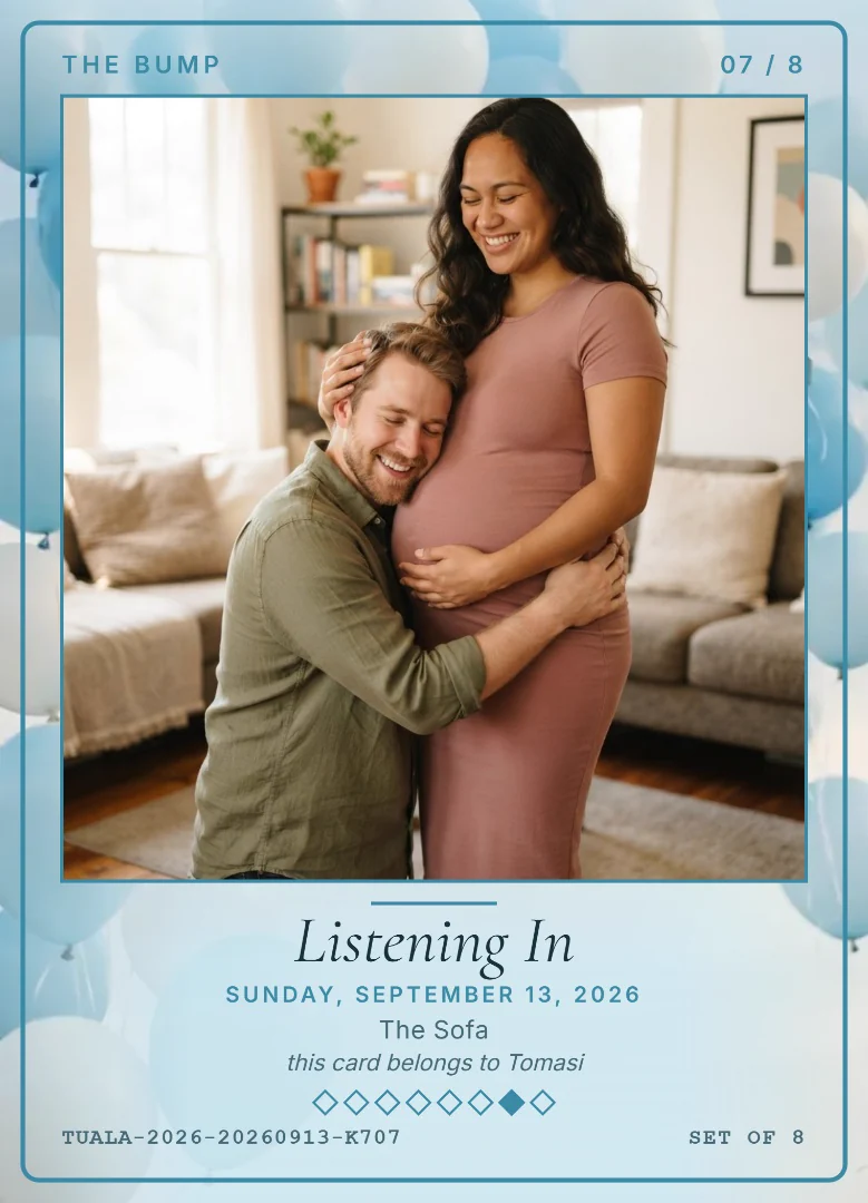 A man kneeling with his ear against his smiling wife&rsquo;s bump in their living room, on a sky blue keepsake card with blue balloons and gift boxes