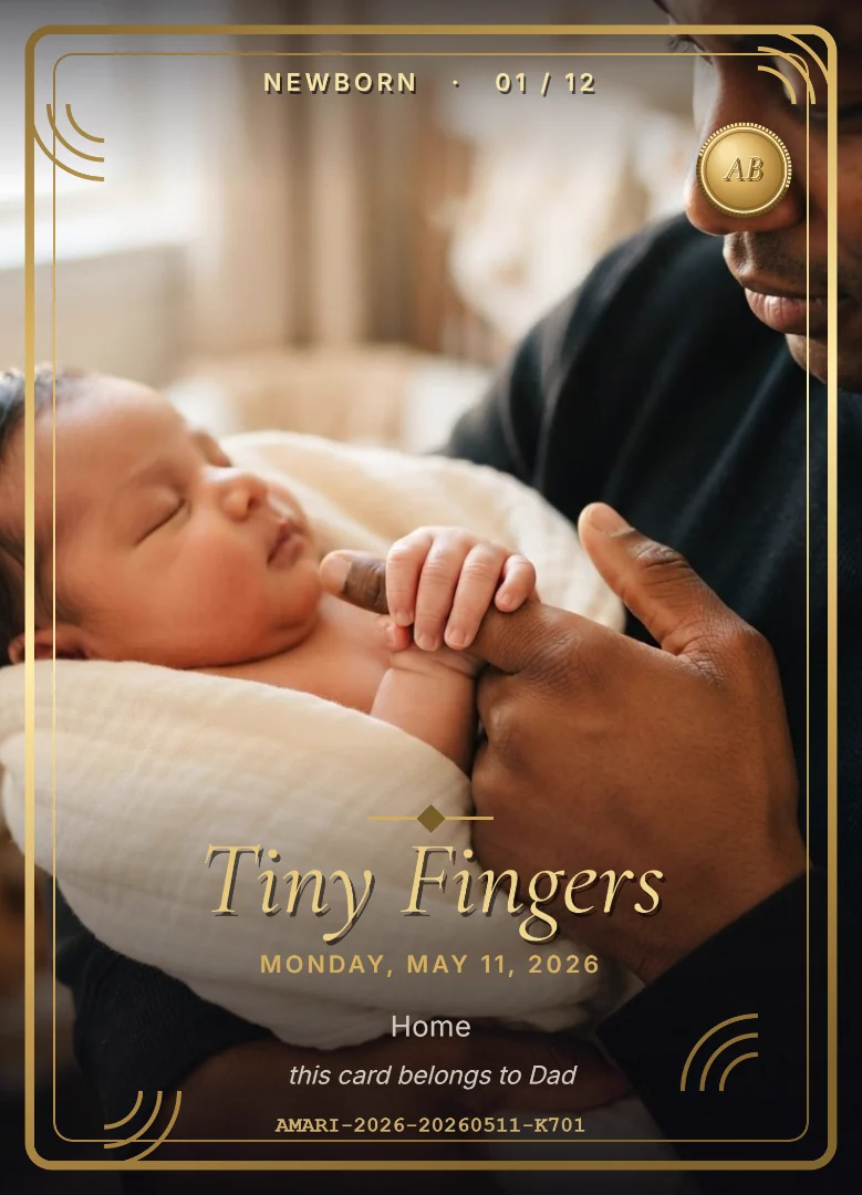 A newborn&rsquo;s tiny hand curled around her father&rsquo;s finger, on a full-bleed black and gold keepsake card